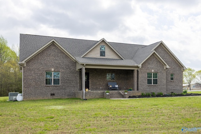 15153 Hobbs Rd, Athens, AL 35614 - view of front of home featuring brick siding, a front yard, a porch, and cooling unit