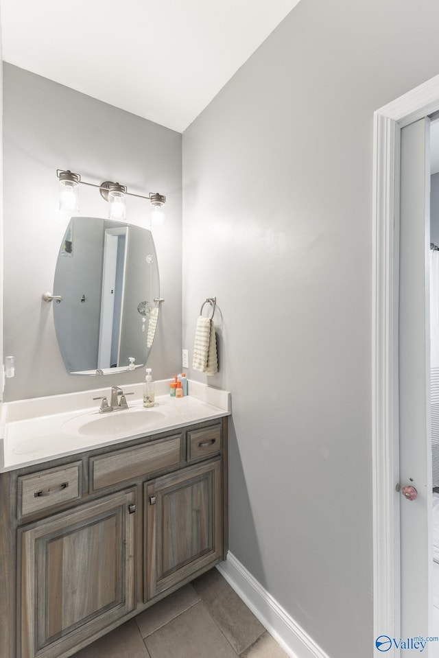 15153 Hobbs Rd, Athens, AL 35614 - bathroom featuring tile patterned floors, vanity, and baseboards
