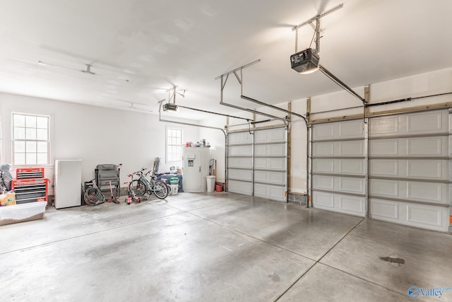 15153 Hobbs Rd, Athens, AL 35614 - garage featuring a garage door opener and water heater