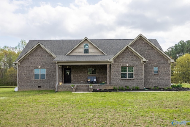 15153 Hobbs Rd, Athens, AL 35614 - view of front of property featuring a shingled roof, a porch, crawl space, brick siding, and a front lawn