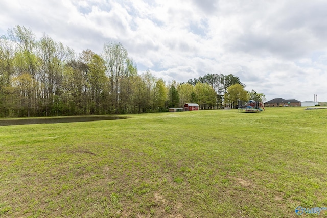 15153 Hobbs Rd, Athens, AL 35614 - view of yard with an outbuilding, a storage unit, and playground community