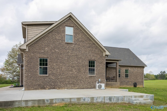 15153 Hobbs Rd, Athens, AL 35614 - rear view of property with a yard, brick siding, a patio area, and ac unit