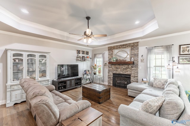 15153 Hobbs Rd, Athens, AL 35614 - living room with a tray ceiling, wood finished floors, and a wealth of natural light