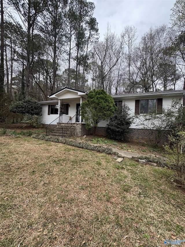 view of front of home with a front yard