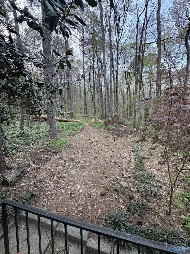 view of yard with a forest view