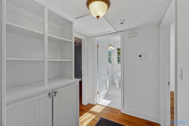 corridor featuring light wood-type flooring