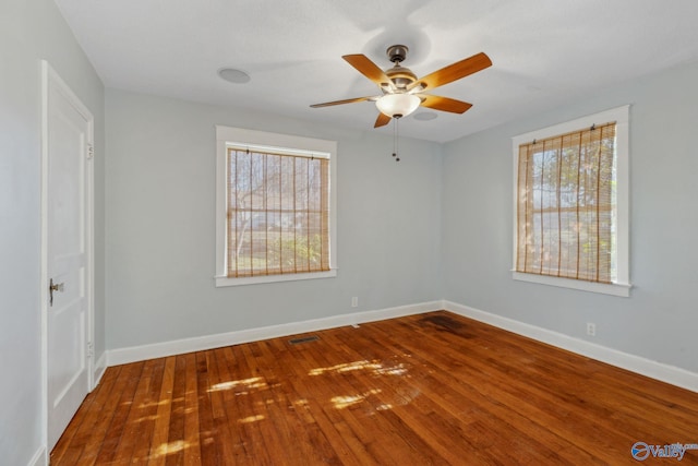 unfurnished room featuring ceiling fan and hardwood / wood-style flooring