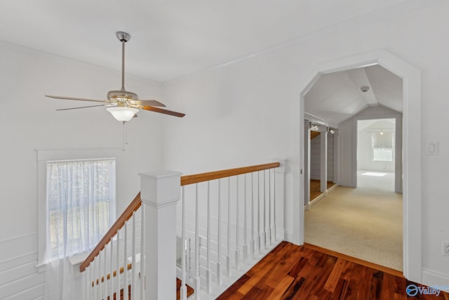 hallway featuring crown molding, lofted ceiling, and hardwood / wood-style flooring