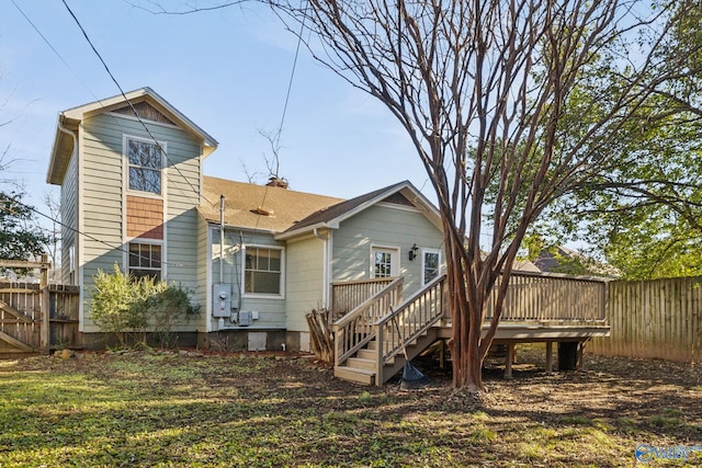 rear view of property with a deck