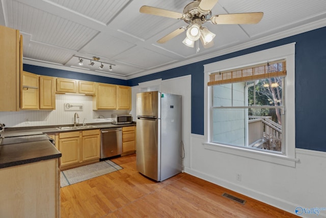 kitchen with stainless steel appliances, light brown cabinets, crown molding, light hardwood / wood-style flooring, and sink