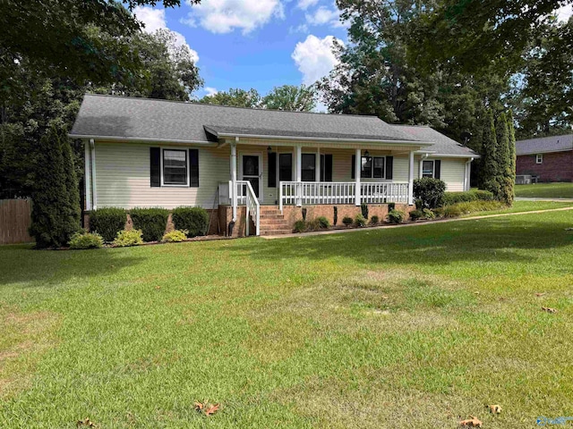 ranch-style house with a front lawn and a porch