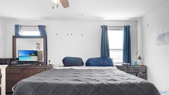 bedroom featuring ceiling fan and visible vents