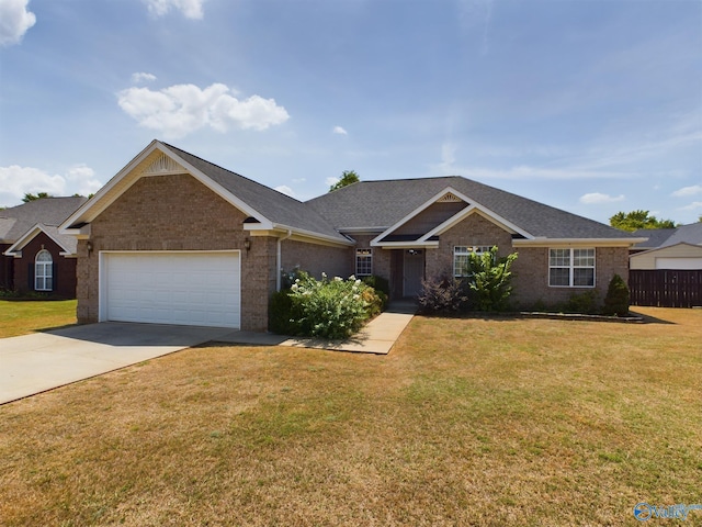 ranch-style house with a front yard, brick siding, driveway, and an attached garage