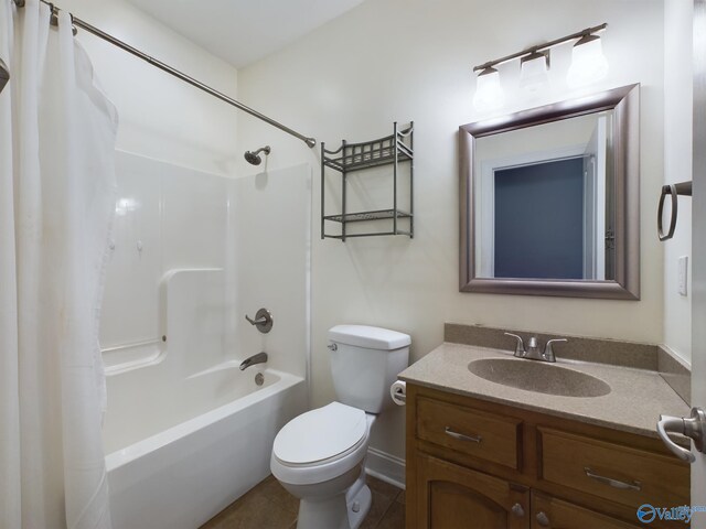 full bathroom featuring tile patterned flooring, vanity, toilet, and shower / tub combo with curtain