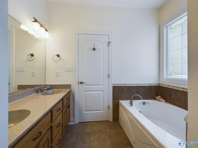 full bathroom with a bath, tile patterned flooring, double vanity, and a sink