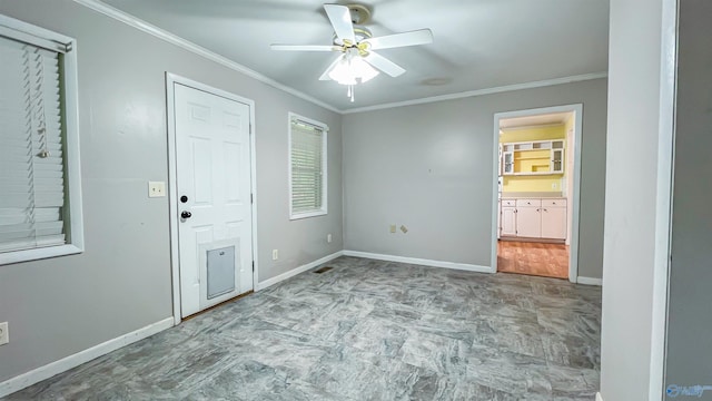 unfurnished bedroom featuring crown molding, ceiling fan, and ensuite bath