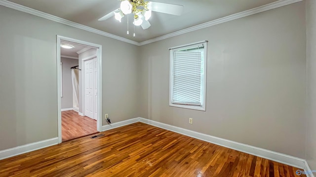 unfurnished bedroom with wood-type flooring, ornamental molding, and ceiling fan