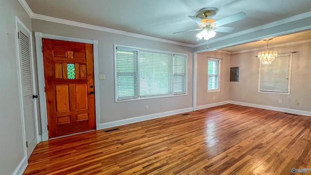 foyer with hardwood / wood-style flooring, crown molding, ceiling fan with notable chandelier, and electric panel