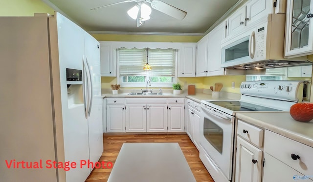 kitchen featuring sink, white cabinets, white appliances, and light hardwood / wood-style flooring