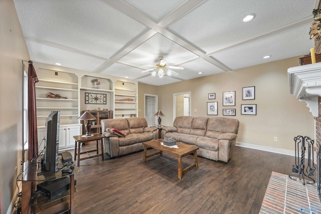 living area with a textured ceiling, baseboards, coffered ceiling, and dark wood-style flooring