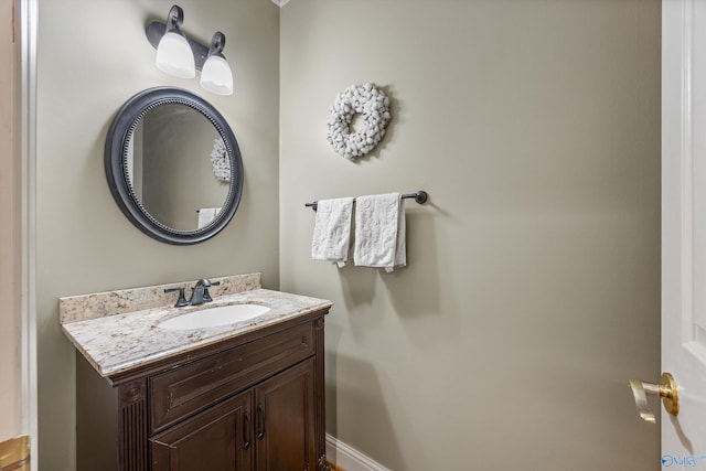 bathroom featuring baseboards and vanity