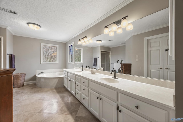 bathroom with ornamental molding, visible vents, and a sink