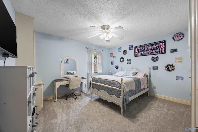 bedroom with a ceiling fan, baseboards, a textured ceiling, and light colored carpet