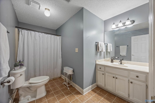 bathroom featuring visible vents, toilet, vanity, baseboards, and tile patterned floors