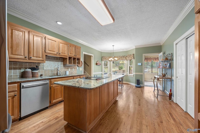 kitchen with dishwasher, a kitchen island, black electric cooktop, light wood-style floors, and a sink