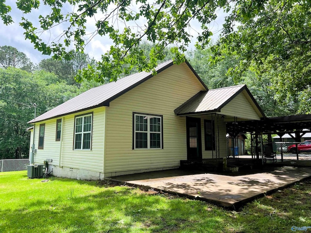 view of front of home featuring metal roof and cooling unit