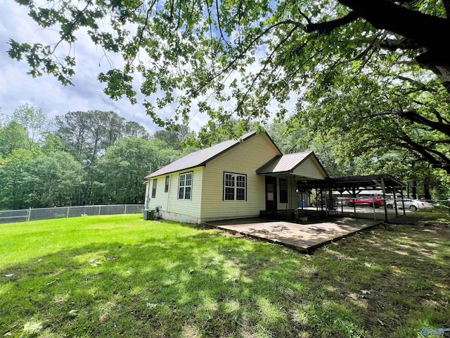 back of property featuring metal roof and central air condition unit