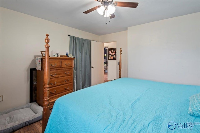 bedroom with hardwood / wood-style floors and ceiling fan