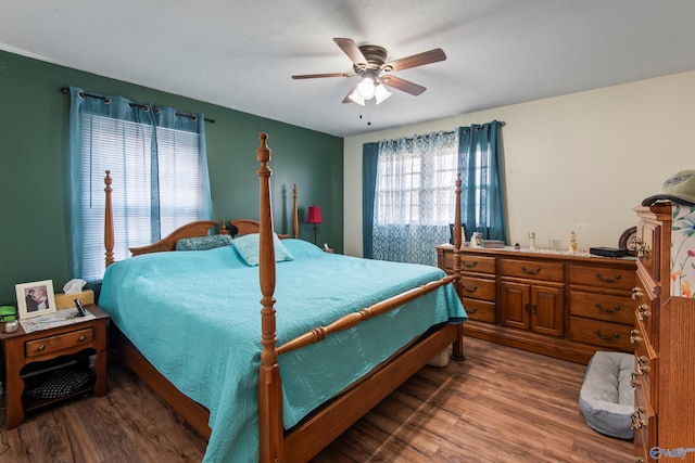 bedroom with wood-type flooring and ceiling fan