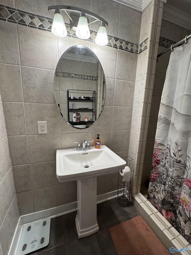 5509 Glade Rd, Anniston, AL 36206 - bathroom with a shower stall, tile patterned flooring, tile walls, and crown molding