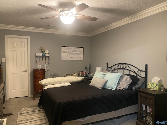 bedroom featuring light carpet, ceiling fan, ornamental molding, and a textured ceiling