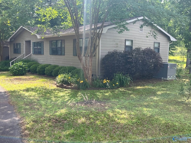 136 Atnip Dr, Scottsboro, AL 35769 - view of home's exterior featuring central AC and a yard