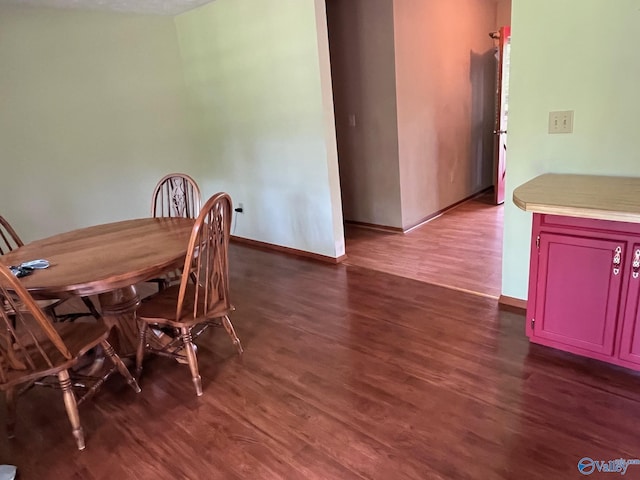 136 Atnip Dr, Scottsboro, AL 35769 - dining area with dark wood-style floors and baseboards