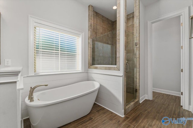 bathroom with shower with separate bathtub