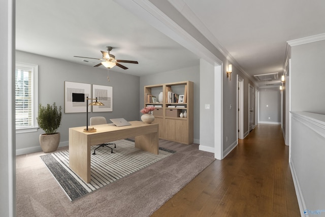 office space featuring dark hardwood / wood-style flooring, ceiling fan, and crown molding