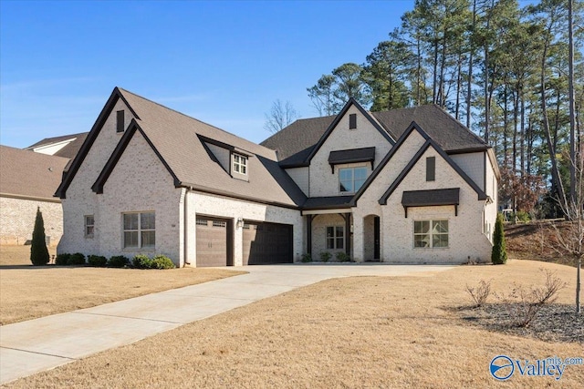 view of front of home with a garage and a front yard