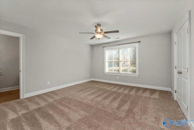 unfurnished bedroom featuring carpet flooring and ceiling fan