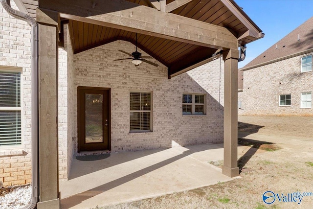 property entrance with a patio and ceiling fan