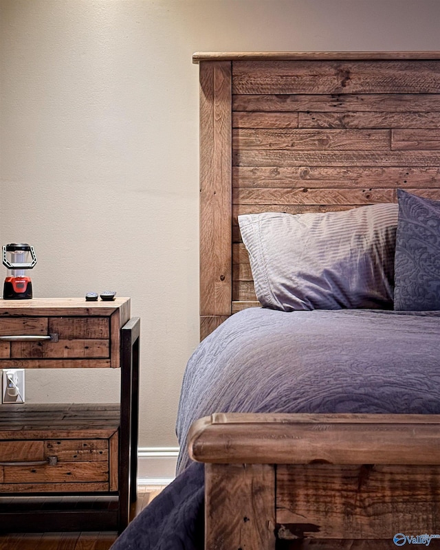 bedroom with hardwood / wood-style floors