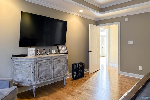 interior space with light wood-type flooring and ornamental molding