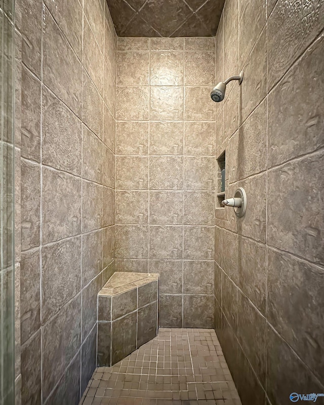bathroom with tiled shower