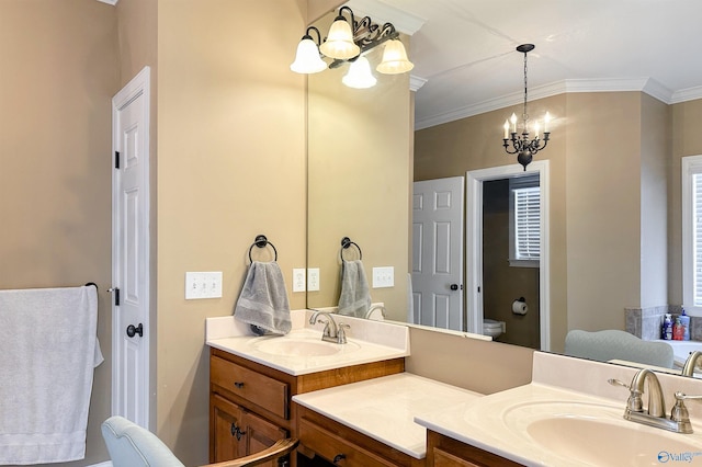 bathroom featuring toilet, vanity, crown molding, and an inviting chandelier