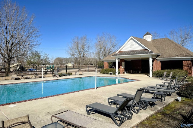 view of swimming pool with a patio area