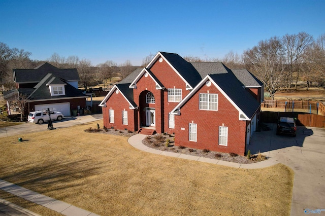 front facade with a garage and a front lawn