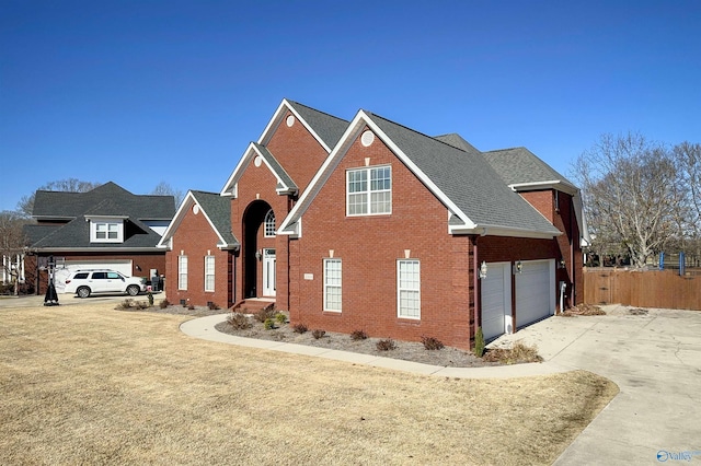 view of front property with a garage and a front lawn