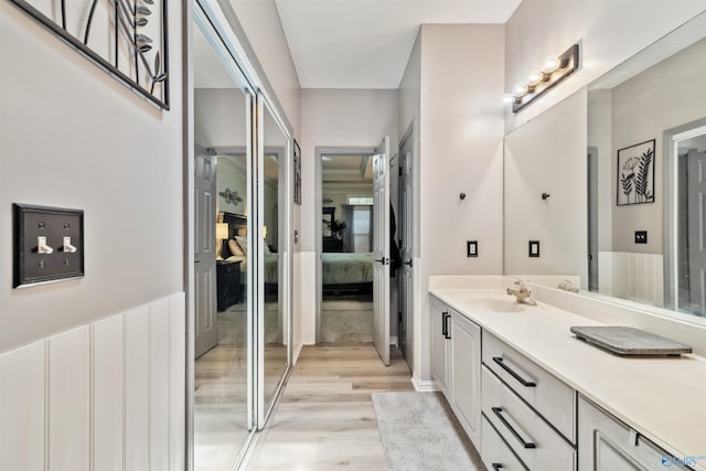 15037 SE Ashmont Blvd, Huntsville, AL 35803 - bathroom featuring connected bathroom, vanity, and wood finished floors